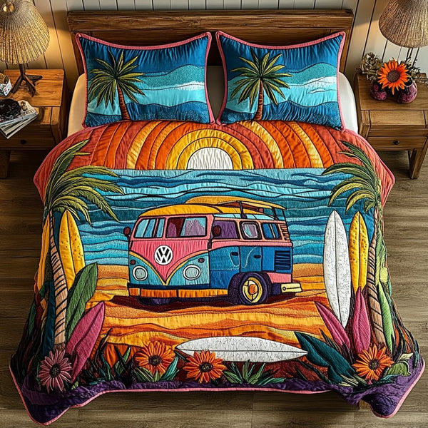 Aqua Retreat quilted 3-piece bedding set on a made bed with two matching pillow shams
