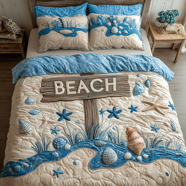 Aqua Time quilted 3-piece bedding set on a made bed with two matching pillow shams