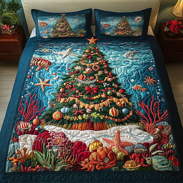 Aqua Tree quilted 3-piece bedding set on a made bed with two matching pillow shams