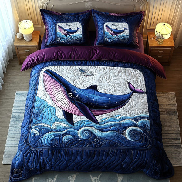 Aqua Voyager quilted 3-piece bedding set on a made bed with two matching pillow shams