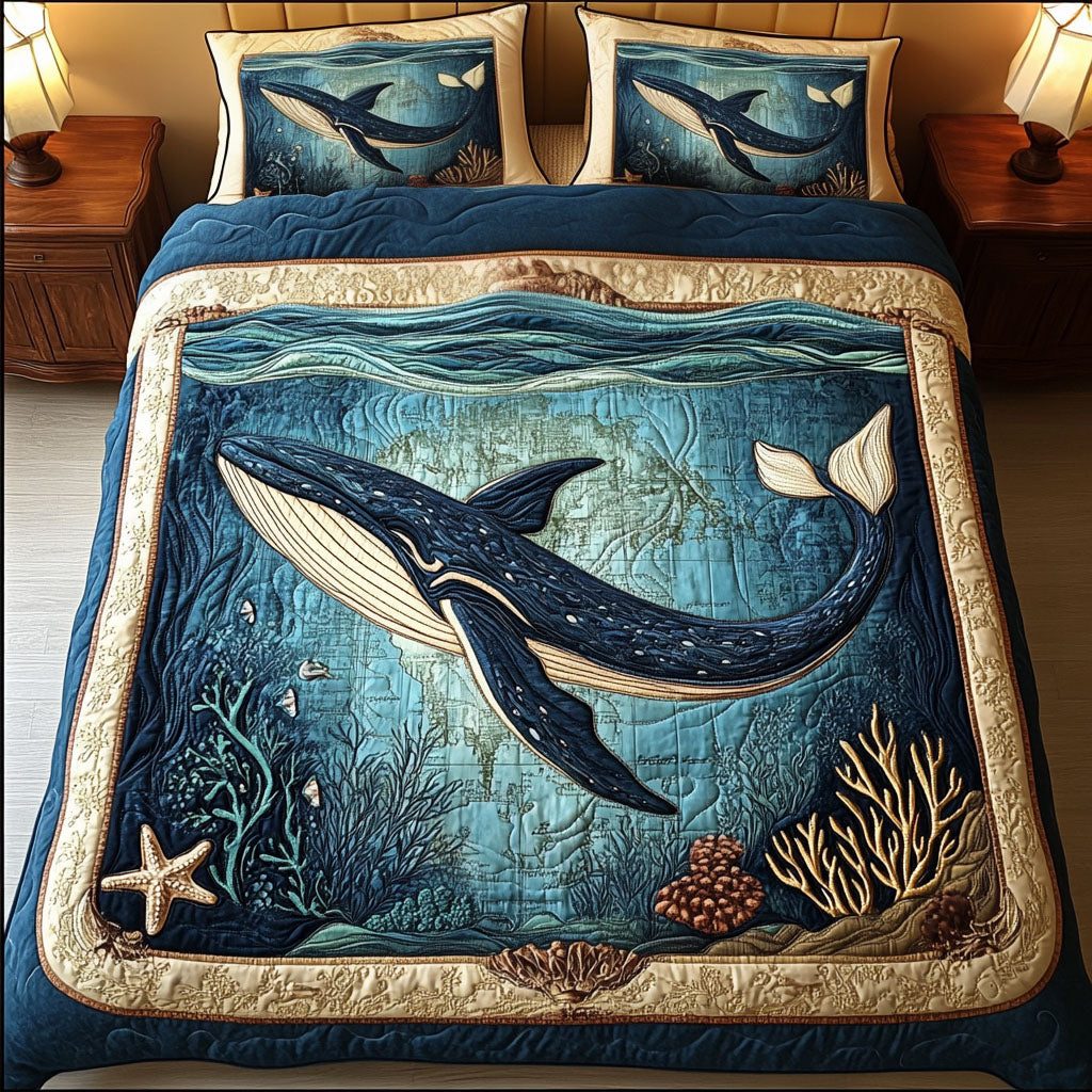 Aqua Whale Voyage quilted 3-piece bedding set on a made bed in a light coastal bedroom