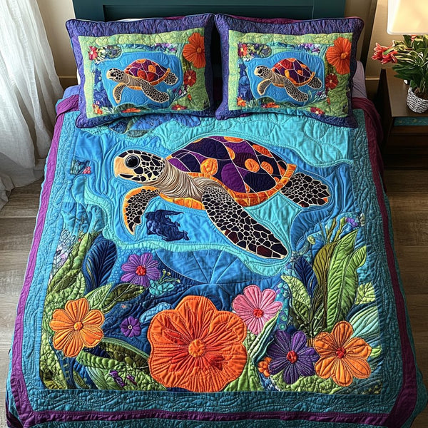 Aquatic Harmony quilted 3-piece bedding set on a made bed with two matching pillow shams