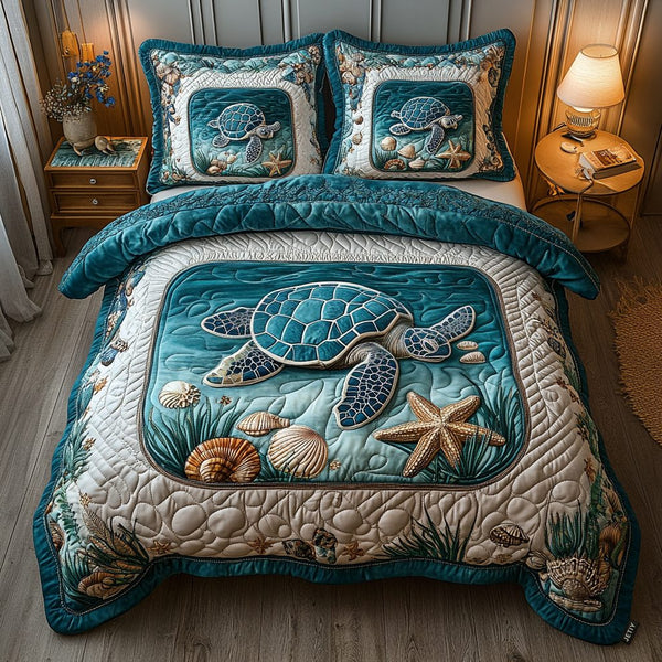 Aquatic quilted 3-piece bedding set on a made bed with two matching pillow shams