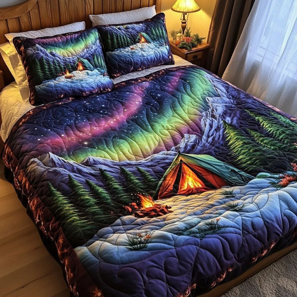 Arctic Campout quilted 3-piece bedding set on a made bed with two matching pillow shams