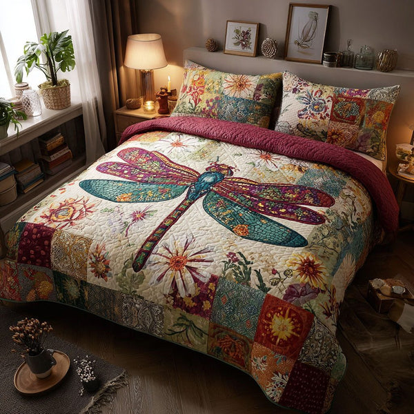 Artistic Flight quilted 3-piece bedding set on a made bed with two matching pillow shams
