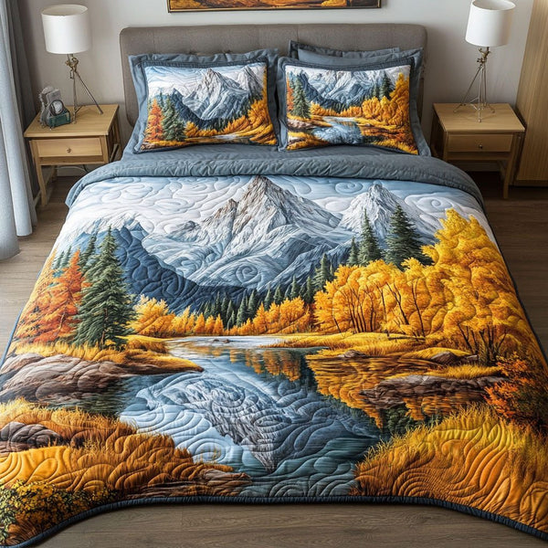 Aspen Glow quilted 3-piece bedding set on a made bed with two matching pillow shams