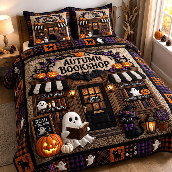 Autumn Bookshop quilted 3-piece bedding set on a made bed with two matching pillow shams