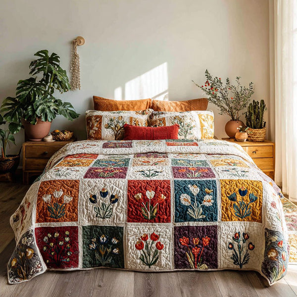 Autumn Botanics quilted 3-piece bedding set on a made bed with two matching pillow shams