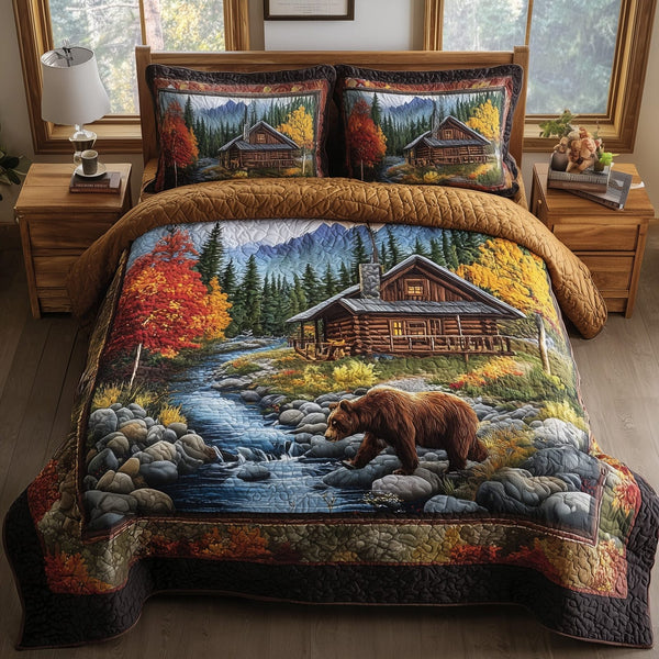 Autumn Cabin Glow quilted 3-piece bedding set on a made bed with two matching pillow shams