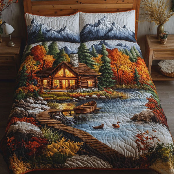 Autumn Cabin Lake quilted 3-piece bedding set on a made bed with two matching pillow shams