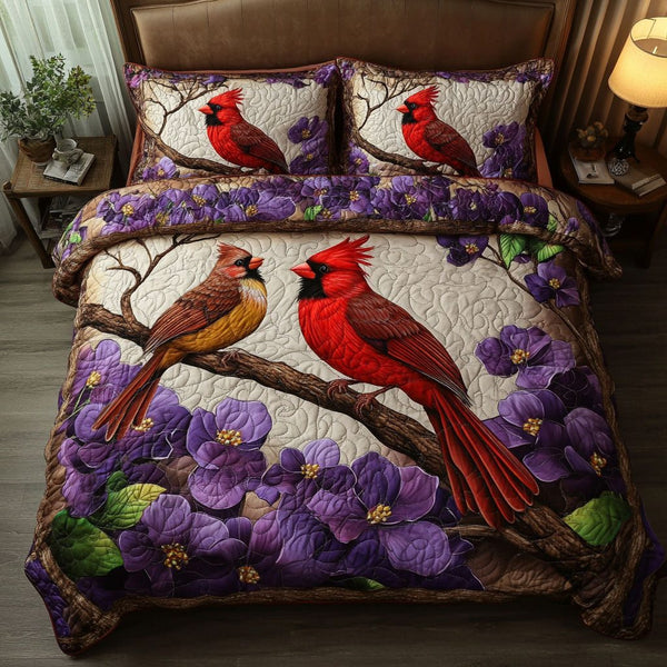 Autumn Cardinals quilted 3-piece bedding set on a made bed with two matching pillow shams