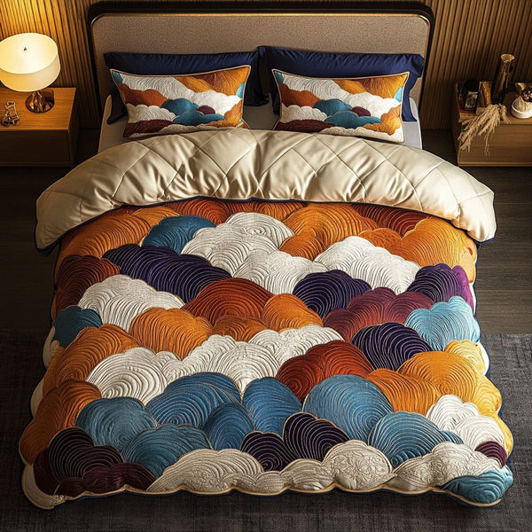 Autumn Clouds quilted 3-piece bedding set on a made bed with two matching pillow shams