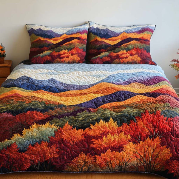 Autumn Glow Valley quilted 3-piece bedding set on a made bed with two matching pillow shams