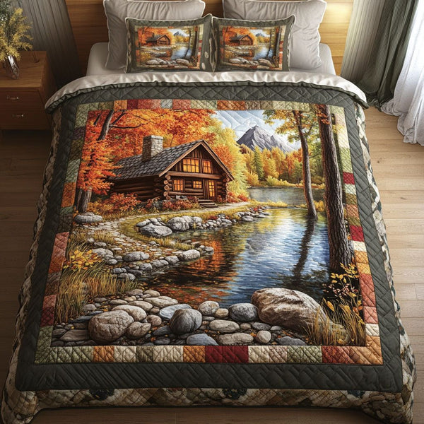 Autumn Lakeside Cabin quilted 3-piece bedding set on a made bed with two matching pillow shams