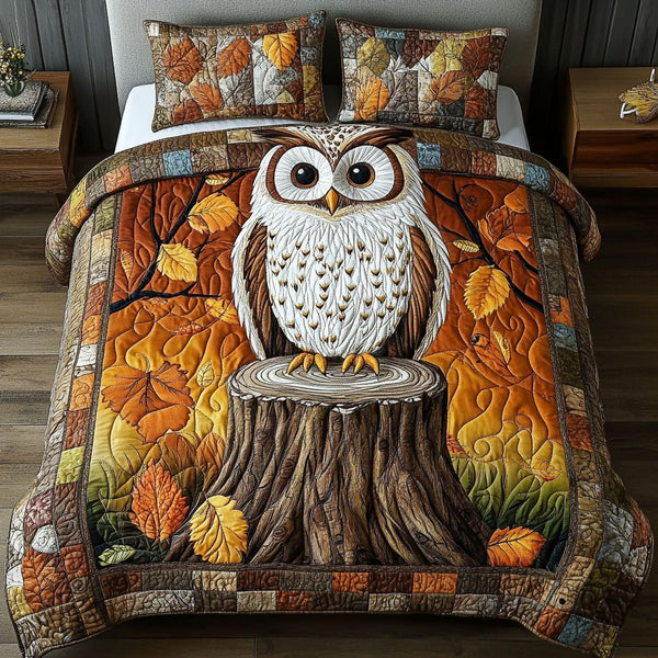 Autumn Perch quilted 3-piece bedding set on a made bed with two matching pillow shams