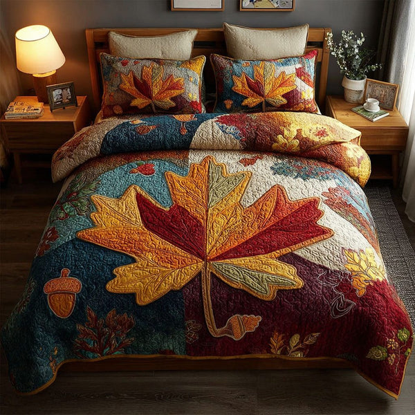 Autumn Reverie quilted 3-piece bedding set on a made bed with two matching pillow shams