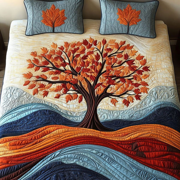 Autumn Tree quilted 3-piece bedding set on a made bed with two matching pillow shams