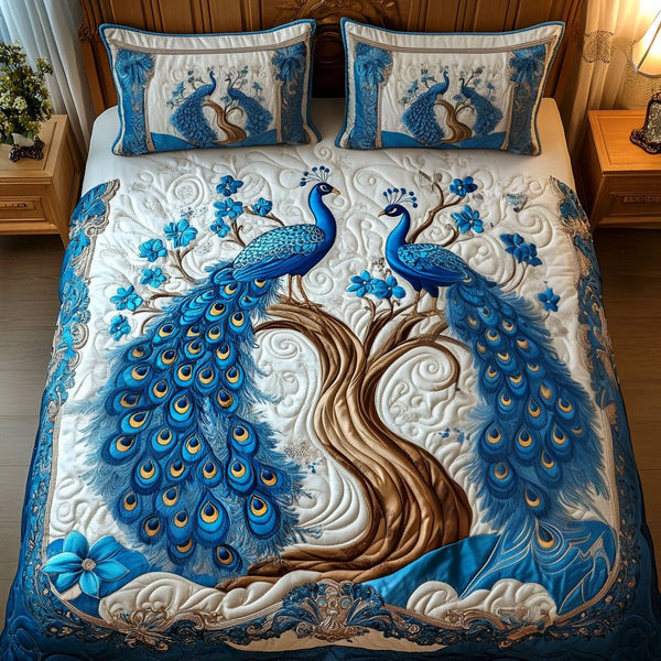 Azure Feathers quilted 3-piece bedding set on a made bed with two matching pillow shams