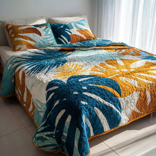 Azure Leaves quilted 3-piece bedding set on a made bed with two matching pillow shams