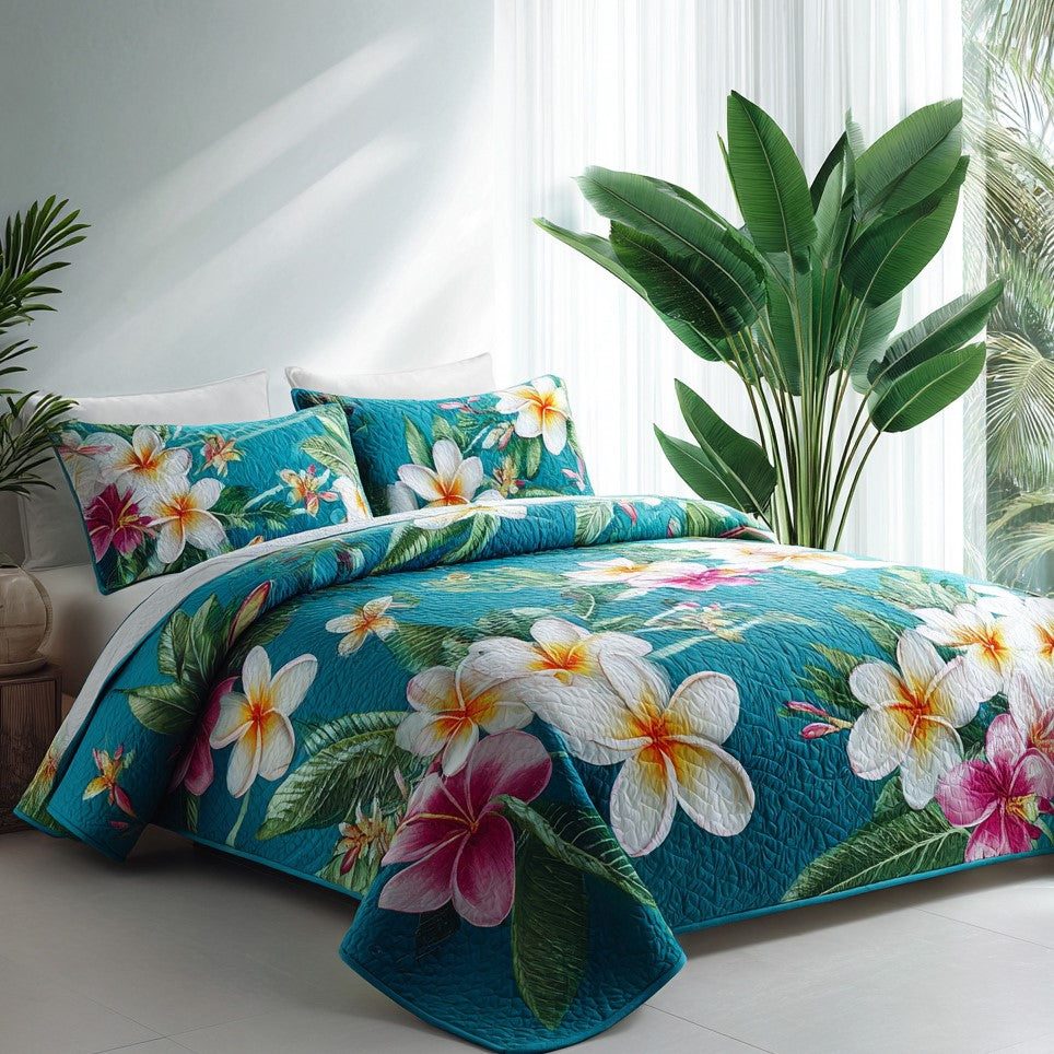 Azure Oasis quilted 3-piece bedding set on a made bed with two matching pillow shams