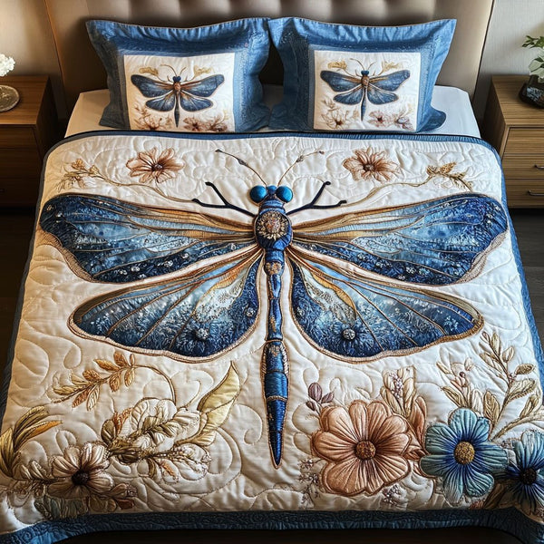 Azure Serenity quilted 3-piece bedding set on a made bed with two matching pillow shams