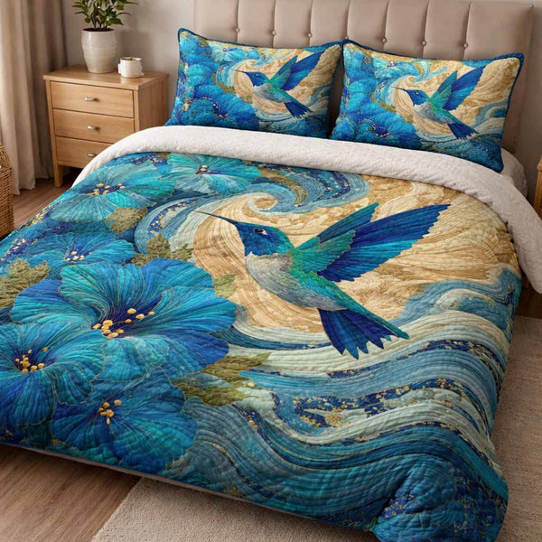 Azure Wings quilted 3-piece bedding set on a made bed with two matching pillow shams