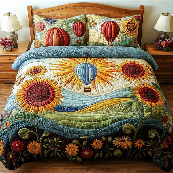 Balloon Bloom Bliss quilted 3-piece bedding set on a made bed with two matching pillow shams