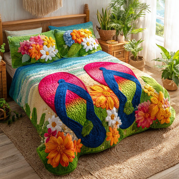 Beach Blooms quilted 3-piece bedding set on a made bed in a light coastal bedroom