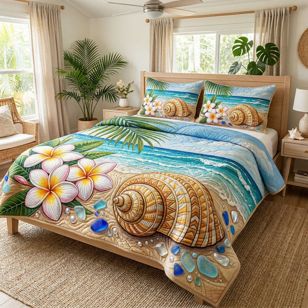 Beach Harmony quilted 3-piece bedding set on a made bed in a light coastal bedroom
