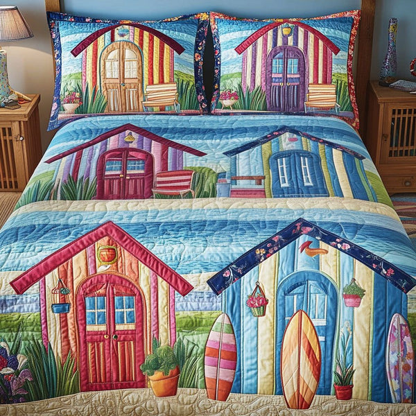 Beach Hut Bliss quilted 3-piece bedding set on a made bed in a light coastal bedroom