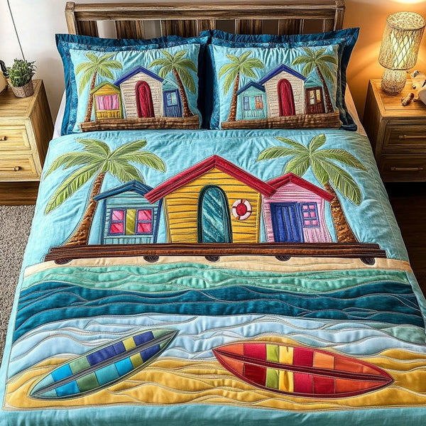 Beach Hut Paradise quilted 3-piece bedding set on a made bed in a light coastal bedroom