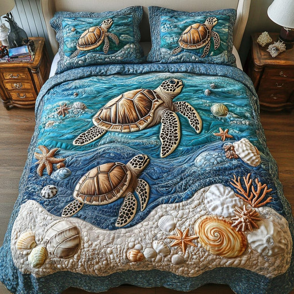 Beach Serenity quilted 3-piece bedding set on a made bed in a light coastal bedroom