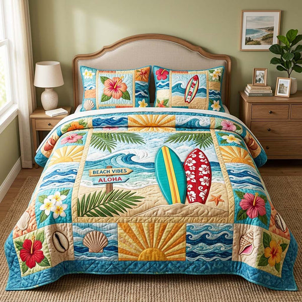 Beach Vibes Aloha quilted 3-piece bedding set on a made bed in a light coastal bedroom
