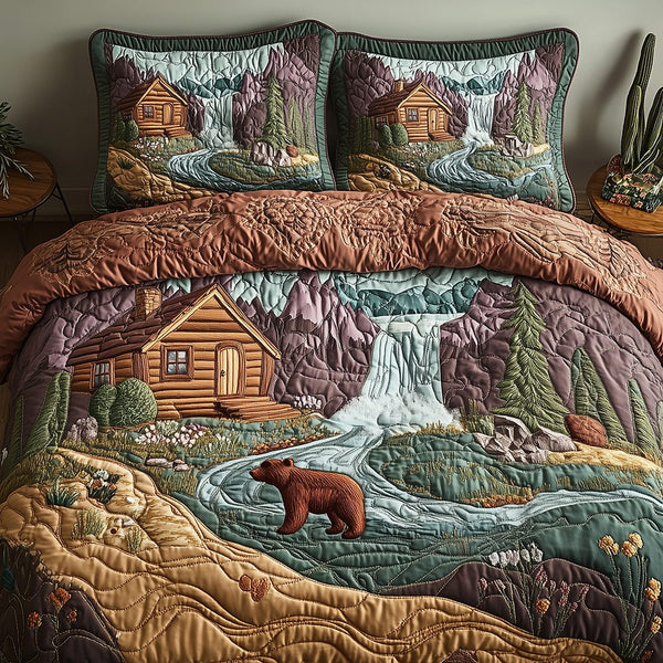 Bear and Cabin quilted 3-piece bedding set on a made bed with two matching pillow shams