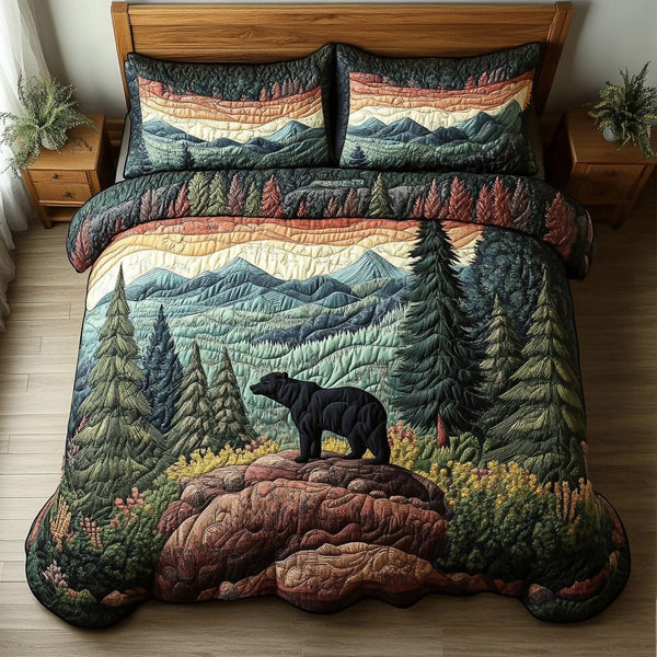 Bear Mountain quilted 3-piece bedding set on a made bed with two matching pillow shams