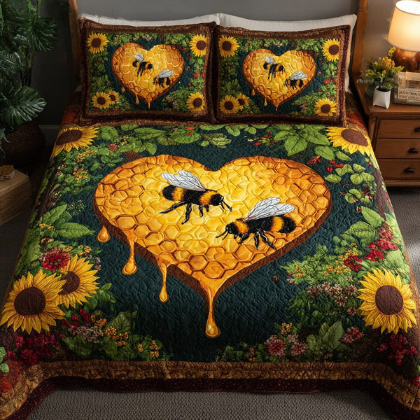Bee Bliss quilted 3-piece bedding set on a made bed with two matching pillow shams