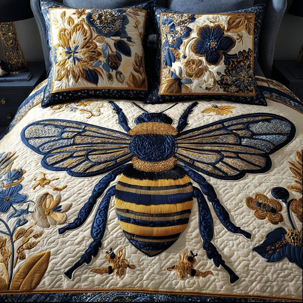 Bee Bloom quilted 3-piece bedding set on a made bed with two matching pillow shams