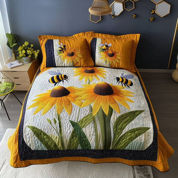 Bee Blossom quilted 3-piece bedding set on a made bed with two matching pillow shams