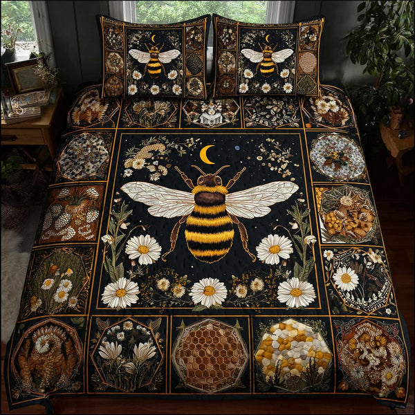 Bee Charm quilted 3-piece bedding set on a made bed with two matching pillow shams