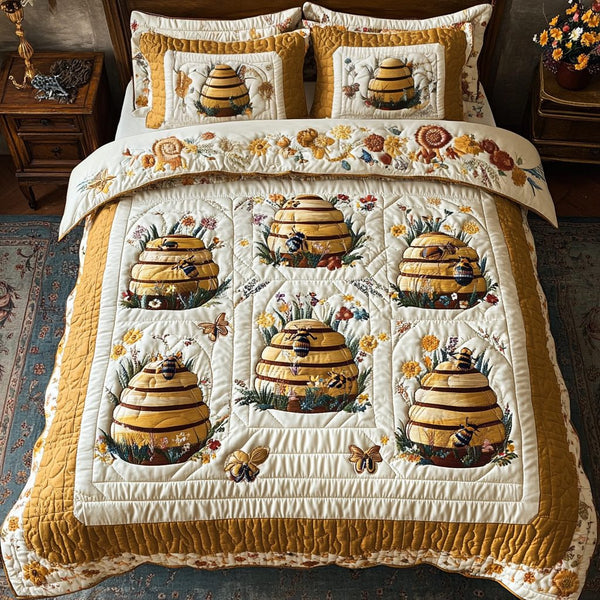 Bee Delight quilted 3-piece bedding set on a made bed with two matching pillow shams