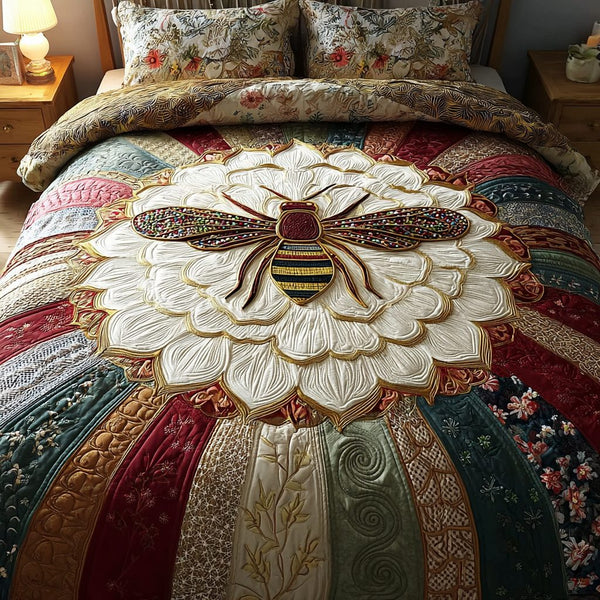 Bee Field quilted 3-piece bedding set on a made bed with two matching pillow shams