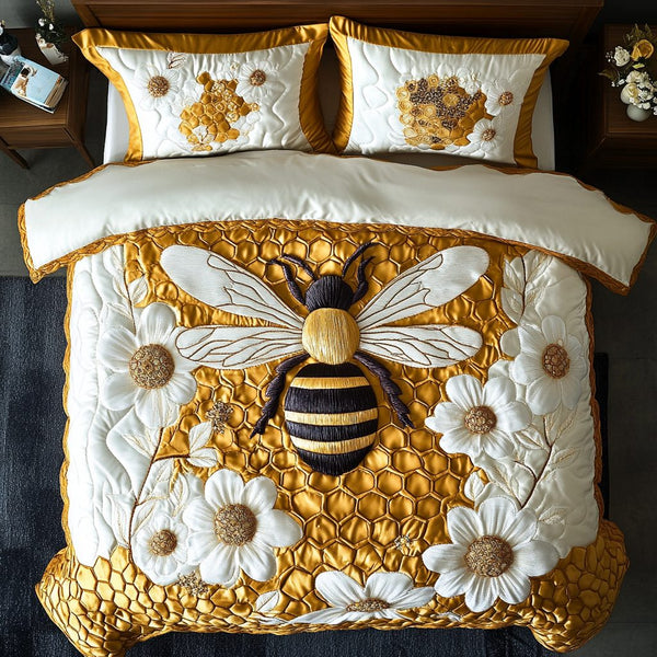 Bee Flight quilted 3-piece bedding set on a made bed with two matching pillow shams