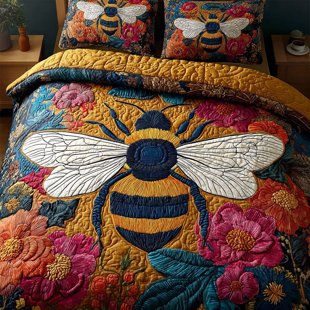 Bee Garden quilted 3-piece bedding set on a made bed with two matching pillow shams