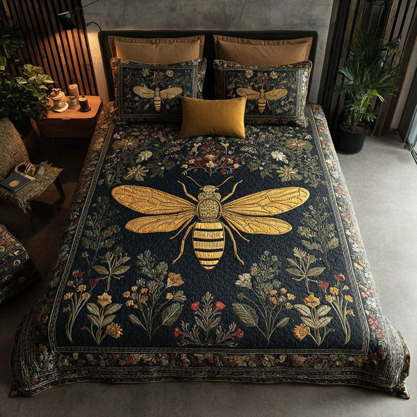 Bee Glow quilted 3-piece bedding set on a made bed with two matching pillow shams