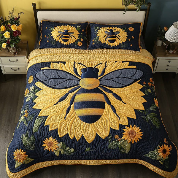 Bee Happy quilted 3-piece bedding set on a made bed with two matching pillow shams