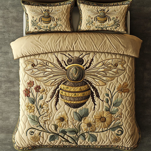 Bee Harmony quilted 3-piece bedding set on a made bed with two matching pillow shams