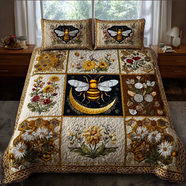 Bee Haven quilted 3-piece bedding set on a made bed with two matching pillow shams