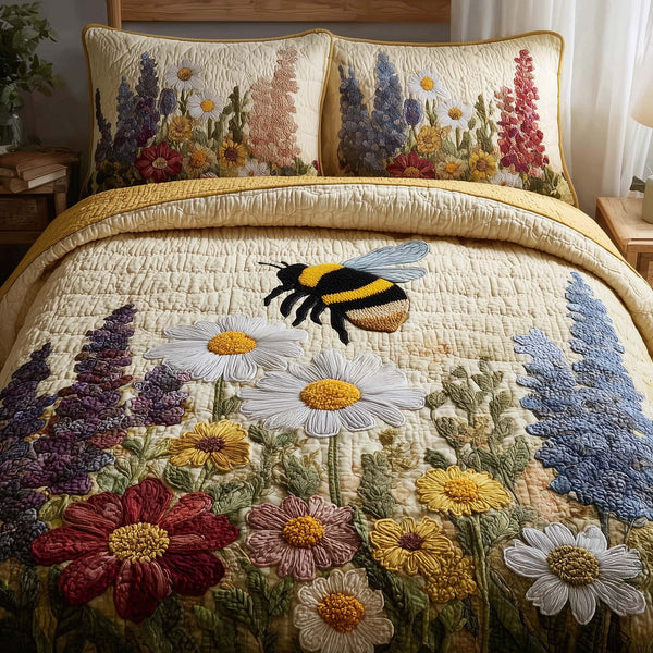 Bee Heaven quilted 3-piece bedding set on a made bed in a softly lit bedroom