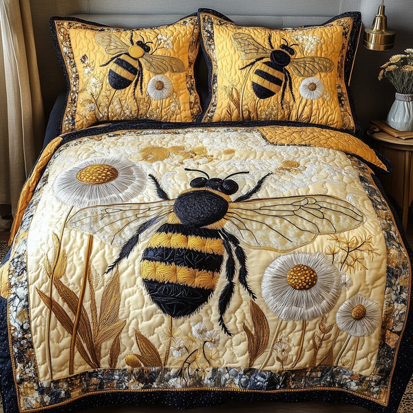 Bee Kind quilted 3-piece bedding set on a made bed with two matching pillow shams