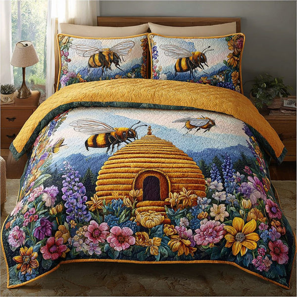 Bee Meadow quilted 3-piece bedding set on a made bed with two matching pillow shams
